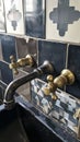 Retro-styled copper faucet collection, which features wall mounted home garden faucets, with an aged brass finish and