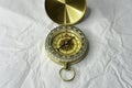 Retro styled golden compass Vintage still life. Sailing accessories. Travel, navigation, history, collecting, hobby