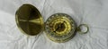 Retro styled golden compass Vintage still life. Sailing accessories. Travel, navigation, history, collecting, hobby