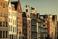 Retro styled image of ancient canal houses in Amsterdam