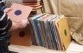 Retro styled image of a collection of old vinyl record lp`s with sleeves on a wooden background. Top view. Copy space Royalty Free Stock Photo