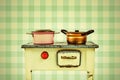 Retro styled image of a doll house cooking stove