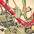Retro styled image of the engine detail of a restored motorcycle Royalty Free Stock Photo