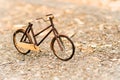 Retro styled image of a nineteenth century bicycle wooden model on a nature background Royalty Free Stock Photo