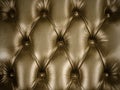 Retro styled image of an old brown couch with buttons Royalty Free Stock Photo