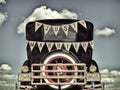 Retro styled image of an old car with just married decoration Royalty Free Stock Photo
