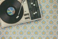 Record player on top of flower wallpaper Royalty Free Stock Photo