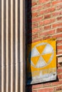 Retro Styled Nuclear Fallout Shelter Sign On A Red brick Wall