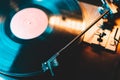 Retro-styled spinning record vinyl player. Close up. Rotating vintage phonograph close up. Beautiful colorful image.