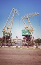 Retro stylized port cranes at Szczecin boulevards, Poland