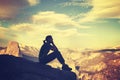 Retro stylized silhouette of a woman watching mountain view. Royalty Free Stock Photo