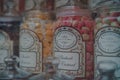 Retro sweets in jars on display in shop window in Cotswolds, UK