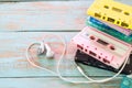 Retro tape cassette with earphone heart shape on wood table. Royalty Free Stock Photo