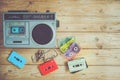 Retro technology of radio cassette recorder music with retro tape cassette on wood table