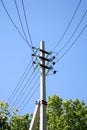 Retro telephone pole with transmission lines in the distance Royalty Free Stock Photo