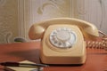 Retro telephone on wooden table in front gradient background