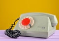 Retro telephone on yellow pastel background. Royalty Free Stock Photo