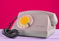 Retro telephone on yellow pastel background. Royalty Free Stock Photo