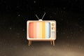 Retro television against starry space background with color bars Royalty Free Stock Photo
