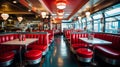 A retro-themed diner with red leather booths and a jukebox