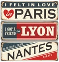 Retro tin sign collection with French cities