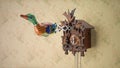 Retro tin toy duck coming out of cuckoo clock