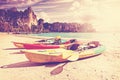 Retro toned kayaks on a tropical beach. Royalty Free Stock Photo