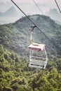 Retro toned picture of an old chairlift in Karst Mountains, China Royalty Free Stock Photo