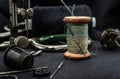 Retro tools for cutting and sewing, Needle with thread, thimble, sewing machine and scissors Royalty Free Stock Photo