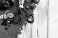 Retro tools for cutting and sewing. Needle with thread, thimble, sewing machine and scissors Royalty Free Stock Photo