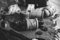 Retro tools for cutting and sewing. Needle with thread, thimble, sewing machine and scissors Royalty Free Stock Photo