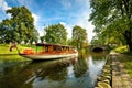 Retro tourist cruise boat on tour in city canal. Riga, Latvia Royalty Free Stock Photo