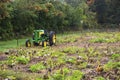A retro tractor abandon in a farm field