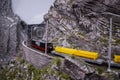 Retro train on a mountain rail landscape