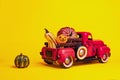 Retro truck with pumpkins on yellow background. Thanksgiving, Halloween and autumn cards concept Royalty Free Stock Photo