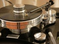 Retro turntable player.Turntables needle on vinyl record disc with music.