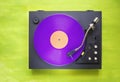 Retro turntable with purple vinyl record Royalty Free Stock Photo