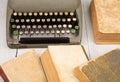 Retro typewriter and old vintage books on white wooden background Royalty Free Stock Photo