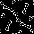 A pattern of bones. seamless pattern of hand-drawn doodles in the style of small bones, randomly arranged white outline on black Royalty Free Stock Photo