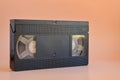 Old black vintage vhs cassette tape, cut out 80s, 90s retro media aesthetic, magnetic videotape movie storage concept