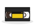 Retro video cassette with black and yellow sticker isolated on a white background. Vintage style movie storage icon. Royalty Free Stock Photo