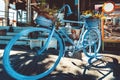 Retro Vintage Blue Bicycle With Basket Of Flowers On Cobblestone Street Royalty Free Stock Photo