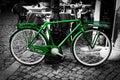 Retro vintage green bike on black and white street background Royalty Free Stock Photo