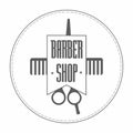 Retro Vintage Insignia barbershop logo in gray color. In it hairdressing scissors and comb wrapped in a ribbon. On the tape label