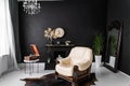 Retro vintage interior. Retro living room interior in dark black colors. Retro leather chair and fireplace Royalty Free Stock Photo