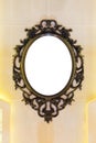 Vintage mirror with metal classic frame on the wall