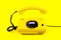 Retro vintage phone handset yellow plastic orange disko background old style shadow 90 Royalty Free Stock Photo