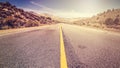 Retro vintage style endless country road, USA. Royalty Free Stock Photo