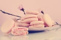 Retro vintage style pink macarons petit fours cookies with spring blossom