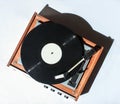 Retro vinyl turntable on white background. Photo with shadows, hard light, top view.
